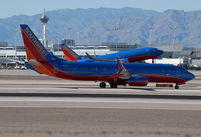 Boeing 737-800 (N8314L) - One of the airlines 737-300s emerges as aircraft N8314L waits for taxi clearance. The 737-800 is fitted with Split-Scimitars.