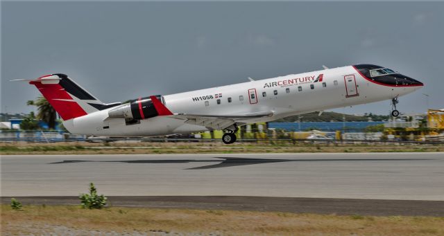Canadair Regional Jet CRJ-200 (HI1058) - Air Century departing St Maarten to Santo Domingo.