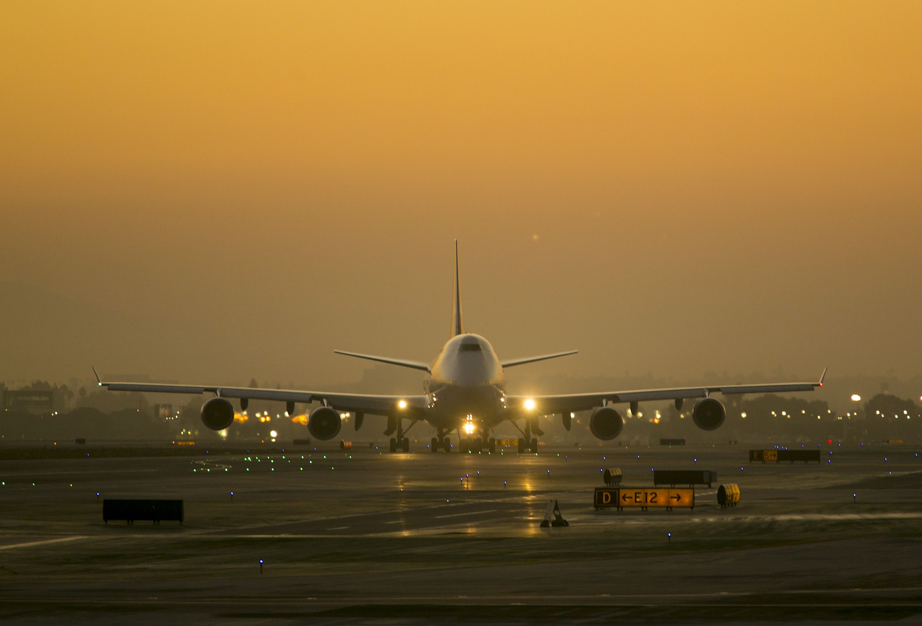 Boeing 747-400 (VH-OEH) - This QANTAS B747 has landed at LAX just before sunrise and is now on the taxiway to the International Terminal. Photo taken Saturday 13 September 2013.