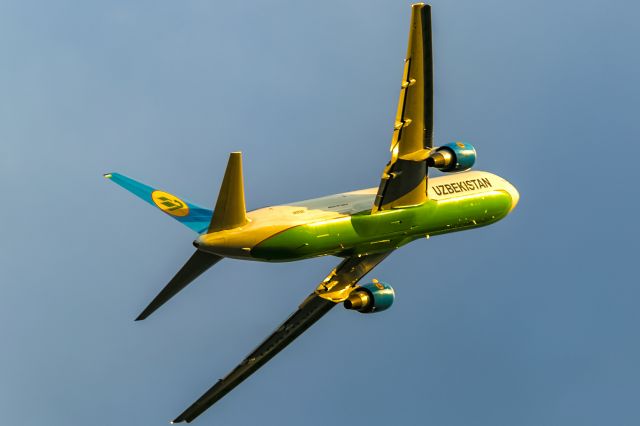 BOEING 767-300 (UK-67001) - westbound with deep yellow evening sun