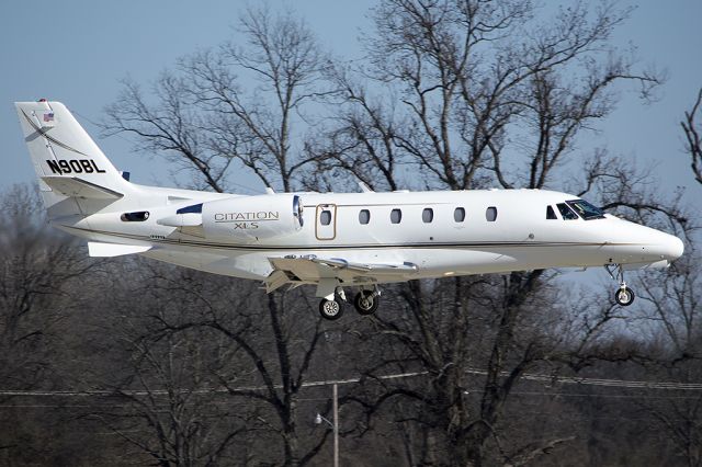 Cessna Citation Excel/XLS (N90BL) - Just before touchdown on runway 18. -January 2014