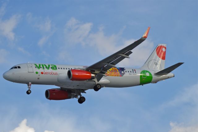 Airbus A320 (XA-VAP) - Airbus A320-232 of VivaAerobus with musical show promotional sticker´s "TECATE Pal Norte 2018" , is on approach to runway 05R  in Mexico City Airport (Photo June 30th 2018).