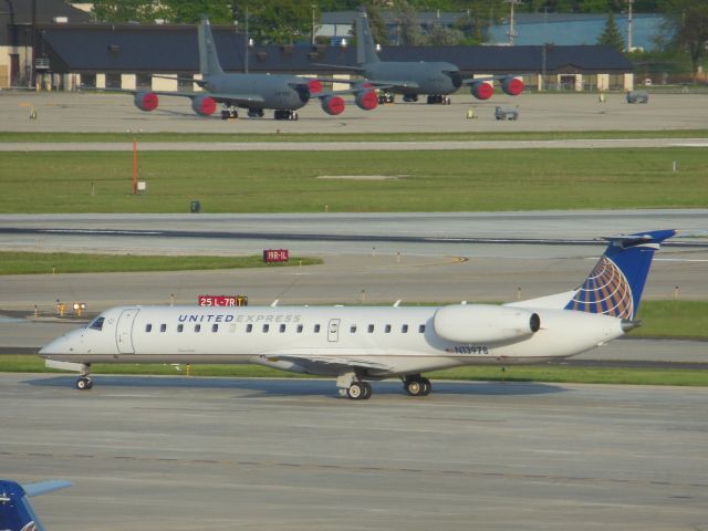 Embraer ERJ-145 (N13798) - United Express/ ExpressJet (UA/EV) N13978 ERJ-145LR [cn145180]br /Milwaukee General Mitchell (MKE). United Express / ExpressJet regional jet taxis for departure. A pair on late 1950’s KC-135’s of the Wisconsin Air National Guard sit parked in the background at the adjacent General Mitchell ANG base. mid-afternoon arrival.  br /Taken from airport car park roofbr /2016 05 26br /a rel=nofollow href=http://alphayankee.smugmug.com/Airlines-and-Airliners-Portfolio/Airlines/AmericasAirlines/United-Express-UA-AXC5EVG7OOYVYXZW-/https://alphayankee.smugmug.com/Airlines-and-Airliners-Portfolio/Airlines/AmericasAirlines/United-Express-UA-AXC5EVG7OOYVYXZW-//a