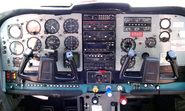 Cessna Centurion (ZS-AVB) - A typical South African cockpit setup. Old, but gets the job done. Lanseria, South Africa.