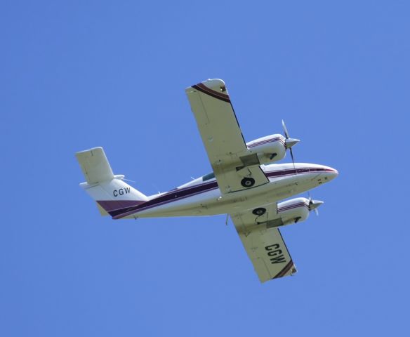 Beechcraft Duchess (AK-CGW) - Fly over of cross runway 26.