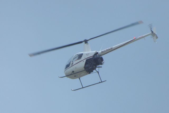 Robinson R-22 (N2362E) - Its been 4 years since I last seen this Helo and posted but sometimes it pays to be in the backyard with a camera nearby.  Shown here is this Robinson R22 Helo flying by in the Spring of 2016.  The photo and camera is much better this time.