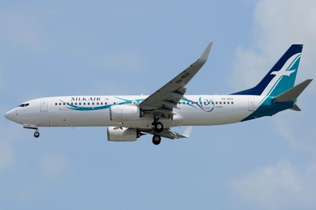 Boeing 737-800 (9V-MGA) - Silkair is replacing its A320 fleet with brand new Boeing 737-800s. Here is the first aircraft in their B737 fleet on its first day of commercial operations. 9V-MGA is on short finals to Runway 02L on its inaugural flight from PEN. Special 25th Anniversary livery.