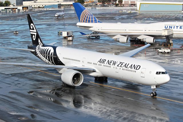 BOEING 777-300 (ZK-OKS) - ANZ 8 taxing in after its flight from Auckland. This was after a bike rain storm.