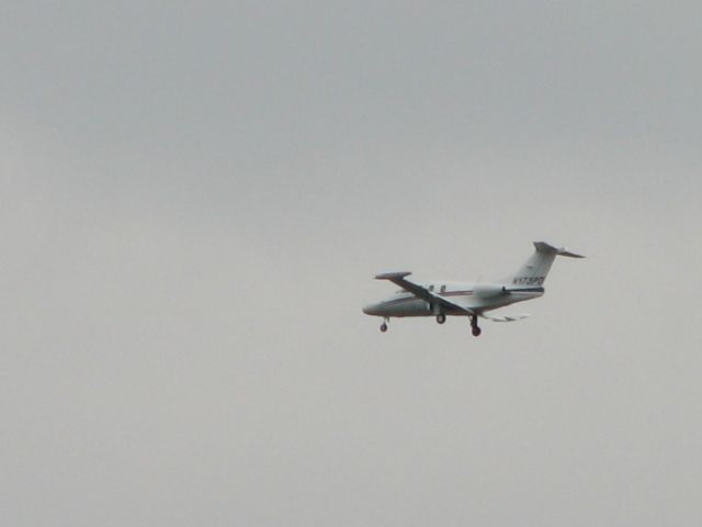 Eclipse 500 (N173PD) - I took this picture from the ground while he was coming around on the downwind leg.  Clearly NOT one of my best efforts.