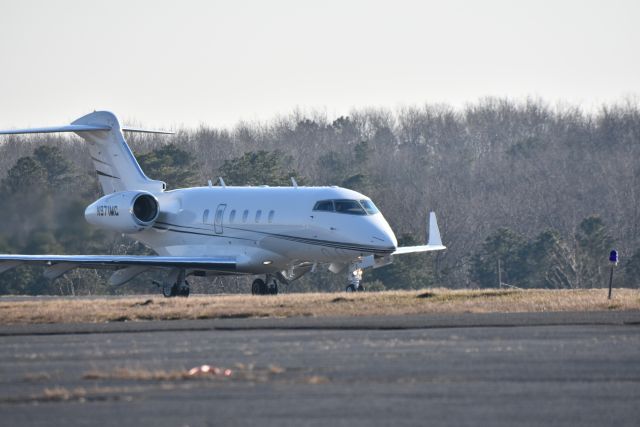 Bombardier Challenger 300 (N971MC) - A Bombadier Challenger 300 starts its takeoff Jan. 2021 from central New Jersey.