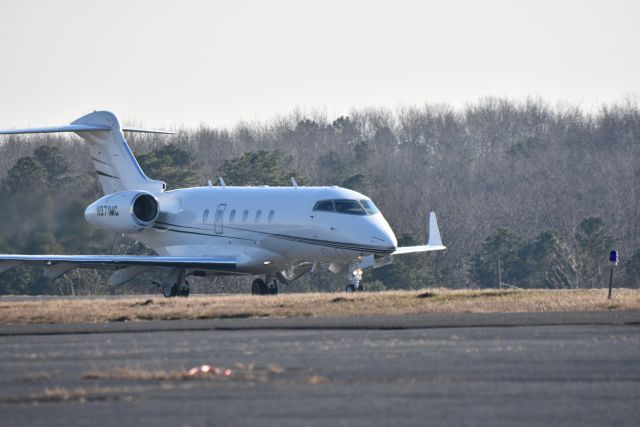 Bombardier Challenger 300 (N971MC) - A Bombadier Challenger 300 starts its takeoff Jan. 2021 from central New Jersey.