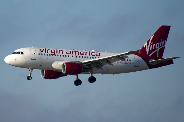 Airbus A319 (N524VA) - Dark Horse landing.