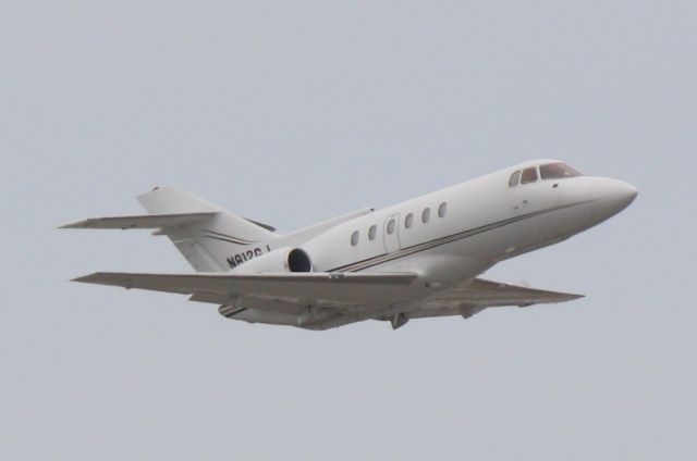 Hawker 800 (N812GJ) - N812GJ departs Runway 14 at Sarasota-Bradenton International Airport enroute to Van Nuys Airport