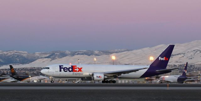 BOEING 767-300 (N130FE) - N130FE (FDX's "Addison," a B763) on its dawn departure roll down Runway 17R.