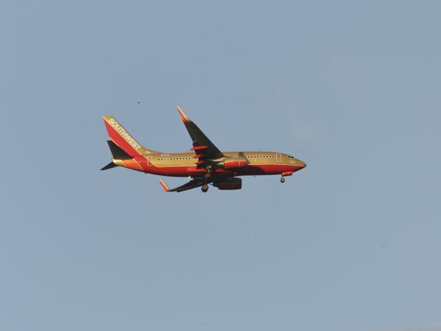 Boeing 737-700 (N714CB) - Sorry for bad quality. It was taken from my backyard.