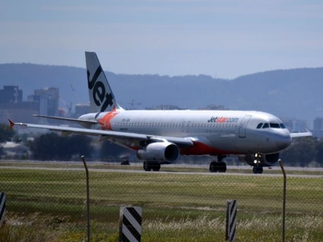 Airbus A320 (VH-JQG) - On taxi-way heading for take off on runway 05.