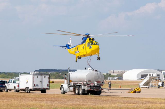 Sikorsky Sea King (N9696W) - Croman Corp Sikorsky S-61 Aerial Firefighter landing at Easterwood after mission over East Texas. Water bucket on the right.