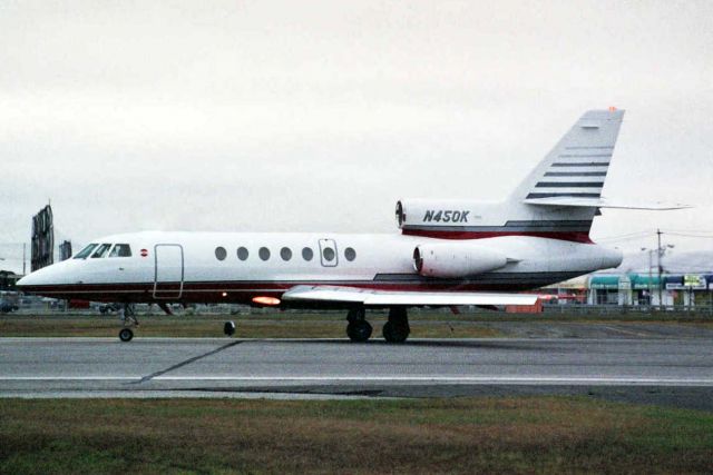 Dassault Falcon 50 (N450K) - Departing rwy 14 in Sep-05.  Reregistered N25SJ 1-Jul-06 then N107A 16-Oct-15.