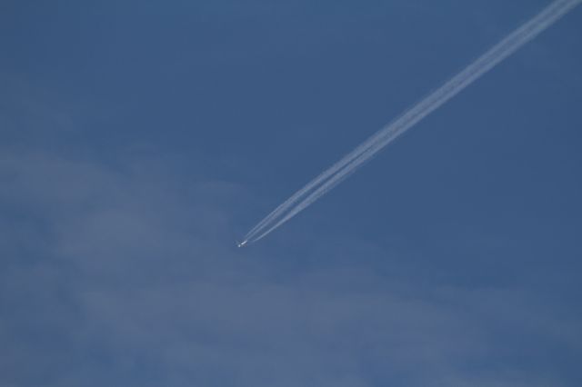 — — - Airplane at cruising altitude flying above Schiphol Airport, Amsterdam Airport on saturday, Februari, 28th. 2015.