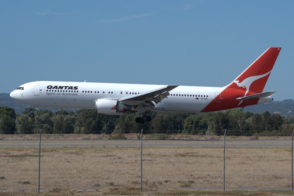 BOEING 767-300 (VH-OGL) - Seconds from putting down on runway 05. Thursday, 4th April 2013.