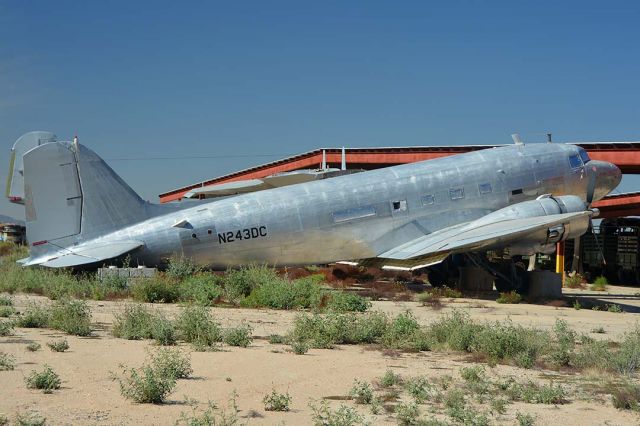 Douglas DC-3 (N243DC) - Douglas DC-3C N243DC in the Lauridsen collection at Buckeye Municipal Airport, Arizona on February 18, 2015. 