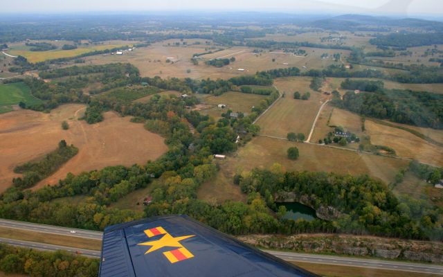 Beechcraft Mentor (N26K) - Looking North over the left wing of T34 Mentor. Below is I40 just East of Lebanon, TN.