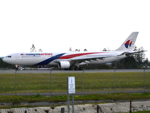 Airbus A330-300 (9M-MTC) - Rolling for take off on runway 05, for flight home to Kuala Lumpur, just before the arrival of a rain storm. Thursday 12th July 2012.