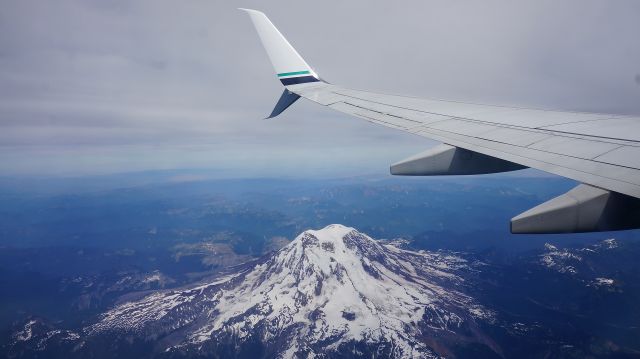 Boeing 737-800 (N558AS) - The stunning Mt. Rainier in the distance below a pair of fancy new split winglets!