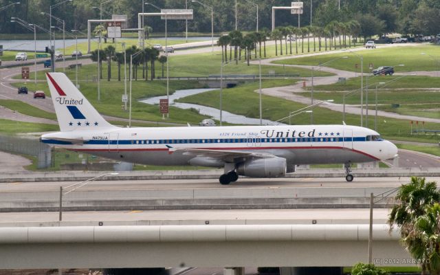 Airbus A320 (N475UA) - United Airlines special livery plane, Friendship One, crossing a bridge at Orlando International Airport on 8-28-12.