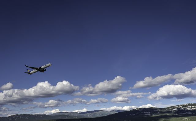 BOEING 737-600 (D-ABUF) - Standing at the end of the runway at YXY watching this beautiful bird fly to Frankfurt