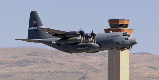 Lockheed C-130 Hercules (92-0548) - The first of a two-ship noon hour  MITO launch, this NevANG Hercules, 920548, passes in front of the RNO Control Tower as it climbs away from 16R..