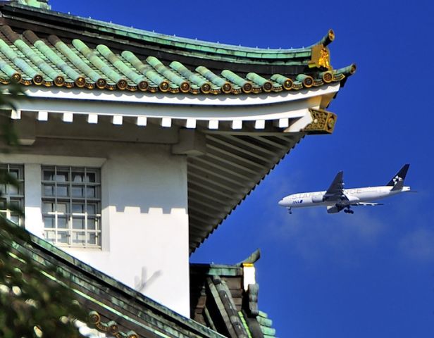 Boeing 777-200 (JA711A) - Star alliance livery approaching to land behind Osaka Castle