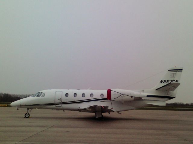 Cessna Citation Excel/XLS (N857CB) - Standing in a lite snow, mid- morning along the north end of the terminal building! 