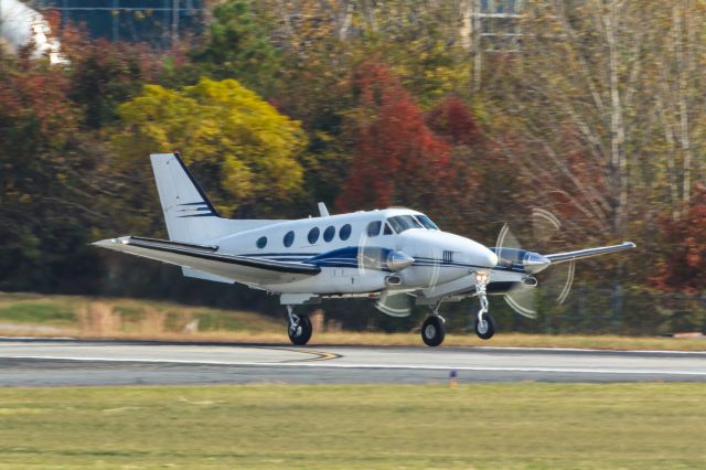 Beechcraft King Air 90 (N78QR) - N78QR is a 2004 Beechcraft King Air C90A seen here departing Atlanta's PDK executive airport. I shot this with a Canon 500mm lens. Camera settings were 1/250 shutter, F18, ISO 400. Please check out my other photography. Positive votes and comments are always appreciated. Questions about this photo can be sent to Info@FlewShots.com