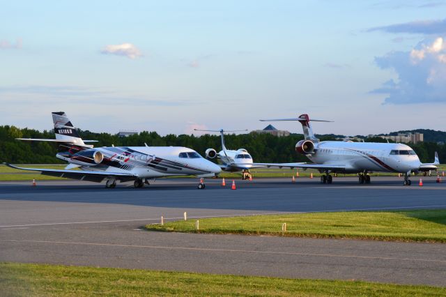 — — - NASCAR team/driver planes (Kyle Busch, Victory Air, JOe Gibbs Racing) parked at KJQF with Charlotte Motor Speedway in the background - 5/30/20