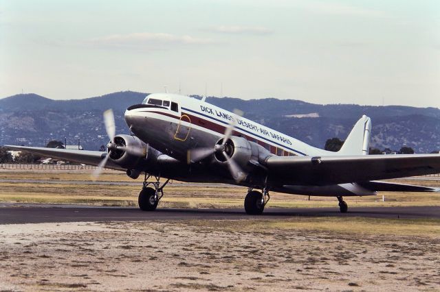 VH-BPN — - DICK LANGS DESERT AIR SAFARIS - DOUGLAS C-47B SKYTRAIN (DC-3) - REG : VH-BPN (CN 16197/32945) - WEST BEACH ADELAIDE SA. AUSTRALIA - YPAD (1/5/1993)35MM SLIDE CONVERSION USING A LIGHTBOX AND A NIKON L810 DIGITAL CAMERA IN THE MACRO MODE
