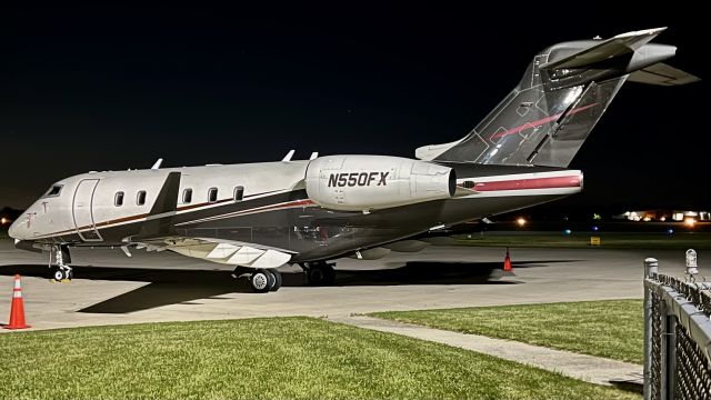 Bombardier Challenger 300 (N550FX) - N550FX, a 2013 Bombardier Challenger 300, under the night sky during its overnight stay @ KVPZ. 6/9/22. 