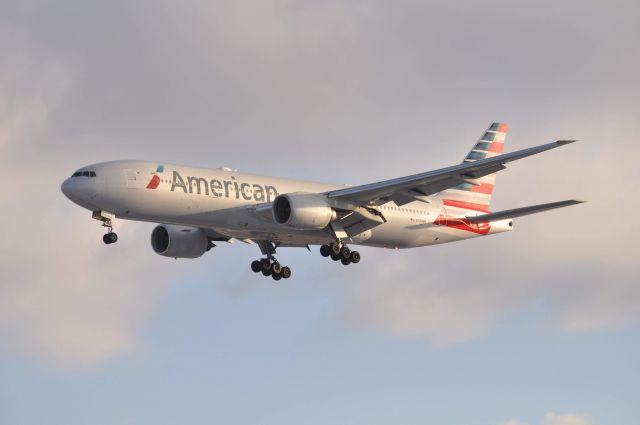 Boeing 777-200 (N789AN) - American 9458 landing 4L at DTW bringing the Dallas Cowboys. Pilots were not too happy for the long taxi over to signature and were trying to get tower to allow them to land on 3R instead.