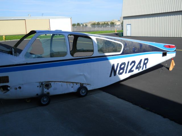 Beechcraft 35 Bonanza (N8124R) - Under repair.  With training wheels.