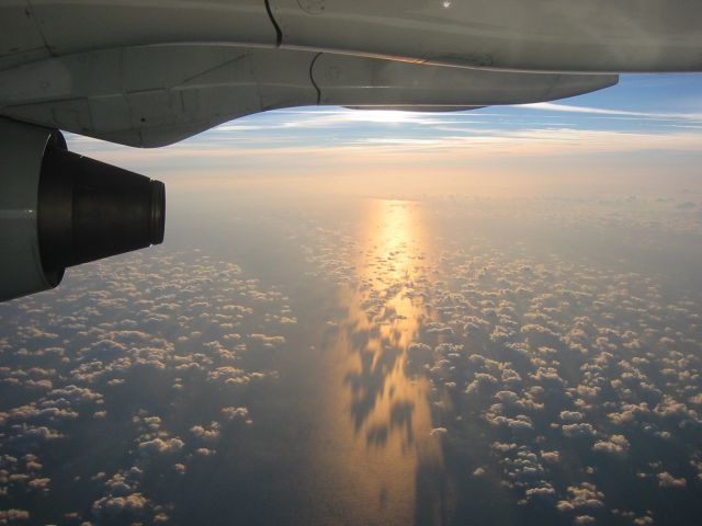 — — - Crossing the English Channel at sunset