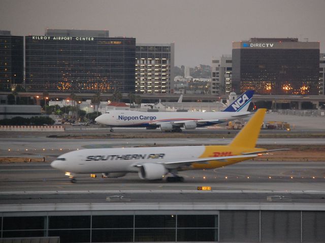 BOEING 777-200LR (N714SA) - Southern Air/DHL 777-200LRF seen in early a.m. with new NCA 748F!