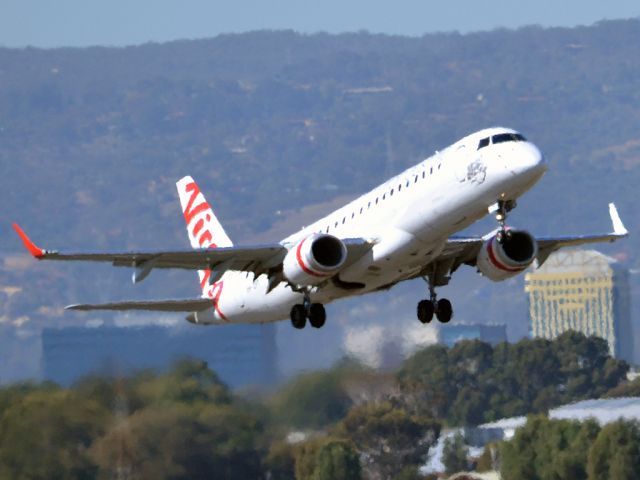 Embraer ERJ-190 (VH-ZPT) - Getting airborne off runway 23 on a beautiful Adelaide autumn day. Thursday 12th April 2012.