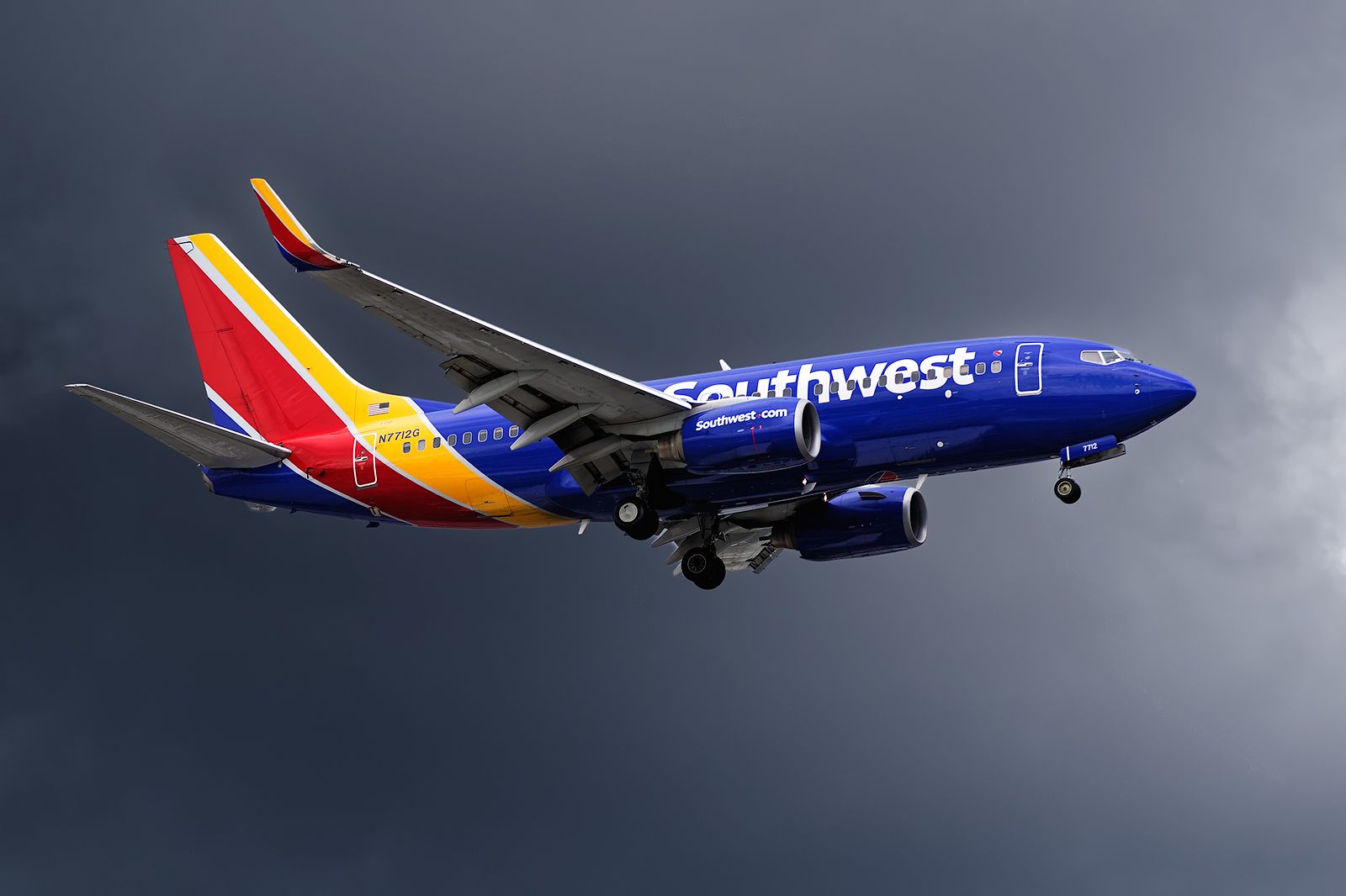 Boeing 737-700 (N7712G) - Short final on 19L just after a thunderstorm had gone by North of the airport. The airport was reconfigured for a while accepting landings only on the short RWY 28.