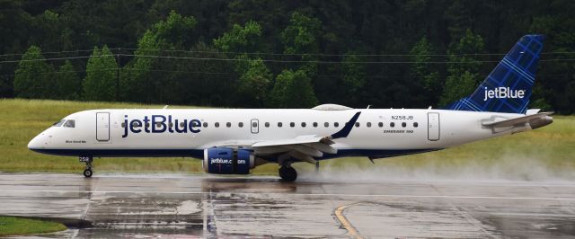 Embraer ERJ-190 (N258JB) - Fresh after a brief but heavy downpour, from the RDU observation deck, 5/17/18.