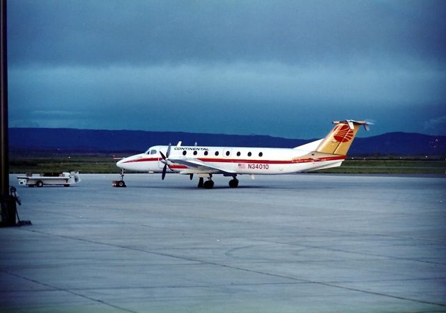 Beechcraft King Air 90 (N34010) - KDRO - Rocky Mtn Express DBa Continental Express - Aug 1988 photo on a stormy night in the summer. We had just returned from the Durango-Silverton Steam Train ride and decided to check out the airport activity - which wasn't much! But, they had a very nice terminal back then.