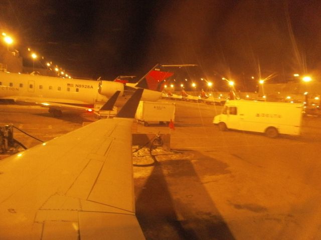 Canadair Regional Jet CRJ-200 (N8718E) - at gate A-12 in KMSP awaiting push back to depart to KPIT on 02 09 2011