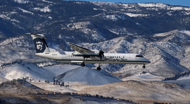 de Havilland Dash 8-400 (N442QX) - The first winter snowfall in the Sierra Nevada was a wonderful sight for drought-stricken northern Nevadans to see, but it makes it rather difficult to see this Horizon Dash 8, N442QX, as it glides in toward runway 34L at KRNO.  At least the background is "appropriate" to the name on the plane: Alaska. 