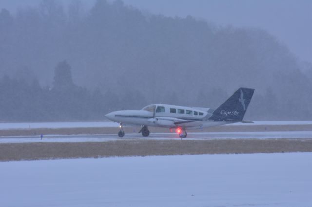 Cessna 402 (N2651S) - A Cape Air Cessna 402C taxiing out for a flight to KSTL on a cold snowy morning