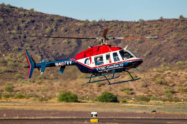 Bell 407 (N407VV) - N407VV coming in for a hover landing for some fuel at Deer Valley Airport.