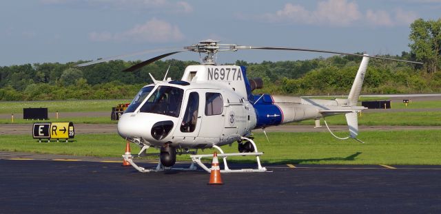 Eurocopter AS-350 AStar (N6977A) - MORRISTOWN, NEW JERSEY, USA-AUGUST 09, 2018: A U.S. Customs and Border Protection helicopter, registration number N6977A, is seen on the ground at Morristown Municipal Airport.